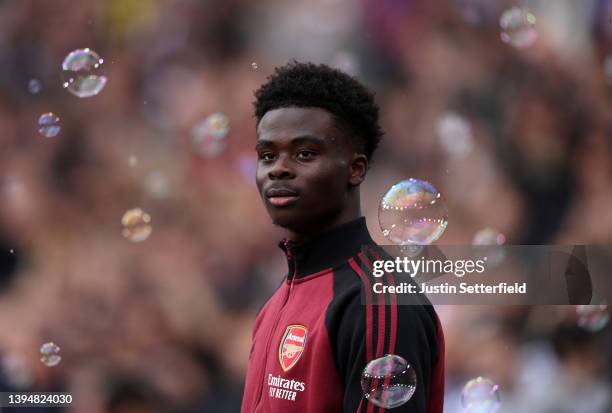 Bukayo Saka of Arsenal walks out for the the Premier League match between West Ham United and Arsenal at London Stadium on May 01, 2022 in London,...