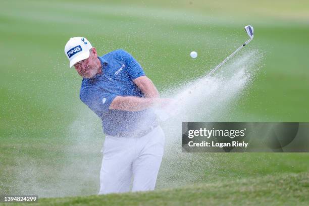 Jeff Maggert of the United States plays his shot from the bunker on the first hole during the final round of the Insperity Invitational at The...