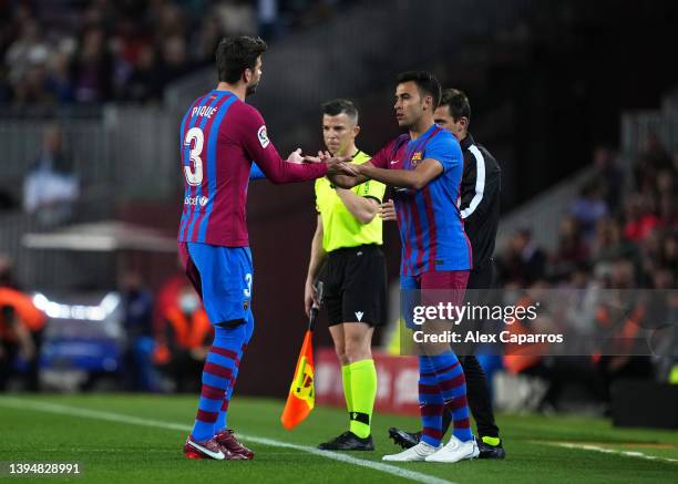 Gerard Pique of FC Barcelona is replaced by Eric Garcia of FC Barcelona during the LaLiga Santander match between FC Barcelona and RCD Mallorca at...