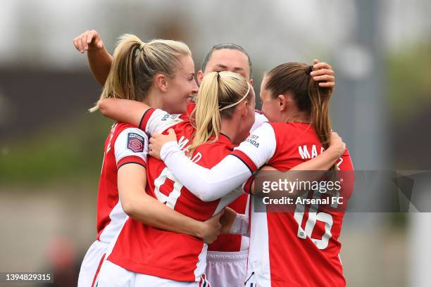 Beth Mead of Arsenal celebrates with teammates Leah Williamson, Katie McCabe and Noelle Maritz after scoring their team's fourth goal during the...
