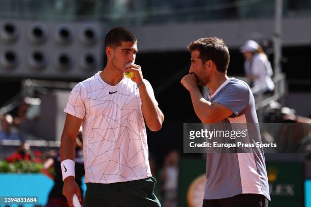 Carlos Alcaraz and Marc Lopez of Spain play doubles against Lukasz Kubot of Poland and Edouard Roger-Vasselin of France during the Mutua Madrid Open...