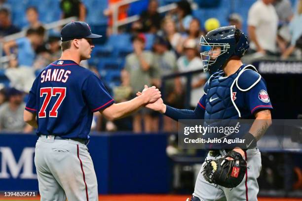 Cole Sands and Gary Sanchez of the Minnesota Twins celebrate after defeating the Tampa Bay Rays 9-3 at Tropicana Field on May 01, 2022 in St...