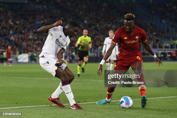 Adama Soumaoro of Bologna battles for possession with Tammy Abraham of AS Roma during the Serie A match between AS Roma and Bologna FC at Stadio...