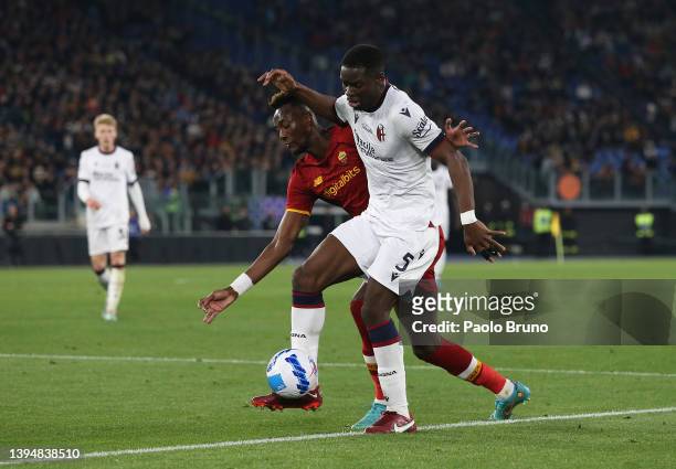 Adama Soumaoro of Bologna battles for possession with Tammy Abraham of AS Roma during the Serie A match between AS Roma and Bologna FC at Stadio...
