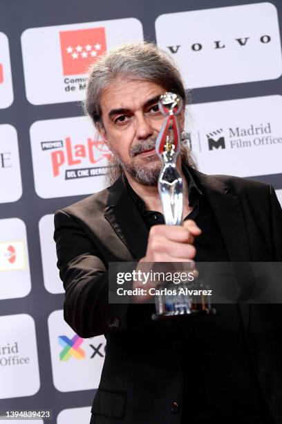 Fernando Leon de Aranoa holds the Best Screenplay Award for the film 'El Buen Patron' during Platino Awards for Ibero-American Cinema 2022 at IFEMA...