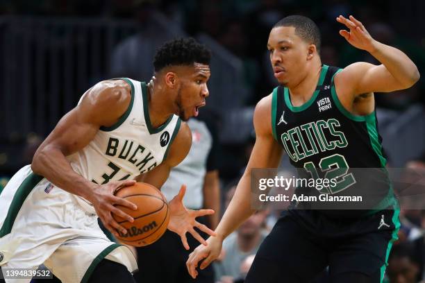 Giannis Antetokounmpo of the Milwaukee Bucks drives to the basket past Grant Williams of the Boston Celtics during a game at TD Garden on May 1, 2022...