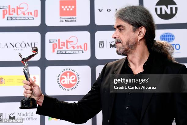 Fernando Leon de Aranoa holds the Best Screenplay Award for the film 'El Buen Patron' during Platino Awards for Ibero-American Cinema 2022 at IFEMA...