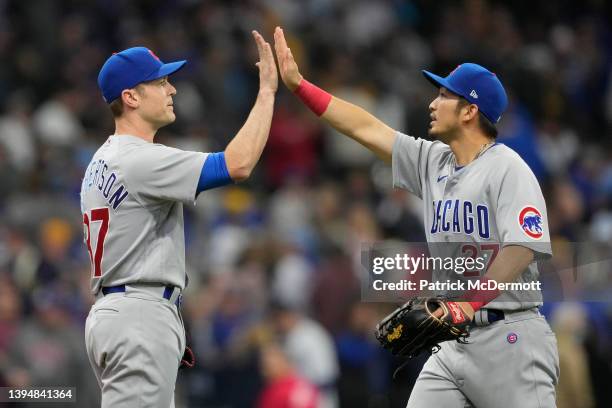 David Robertson and Seiya Suzuki of the Chicago Cubs celebrate after defeating the Milwaukee Brewers 2-0 at American Family Field on May 01, 2022 in...