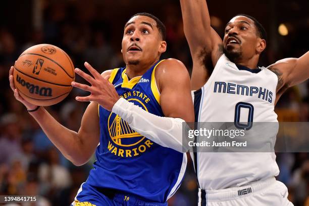 Jordan Poole of the Golden State Warriors goes to the basket against De'Anthony Melton of the Memphis Grizzlies during Game One of the Western...