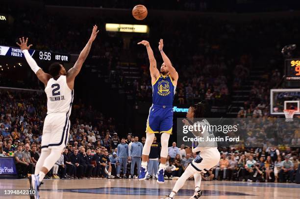 Stephen Curry of the Golden State Warriors shoots against Xavier Tillman of the Memphis Grizzlies and Ja Morant of the Memphis Grizzliesduring Game...