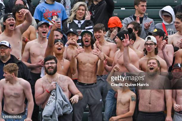 Fans are seen cheering without their shirts in the ninth inning of the game between the Chicago White Sox and the Los Angeles Angels at Guaranteed...