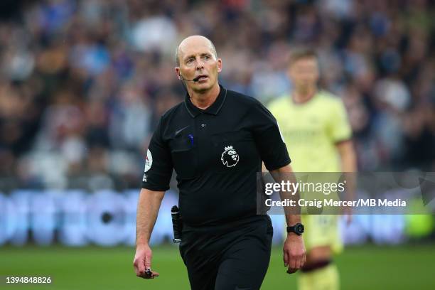 Referee Mike Dean during the Premier League match between West Ham United and Arsenal at London Stadium on May 1, 2022 in London, United Kingdom.