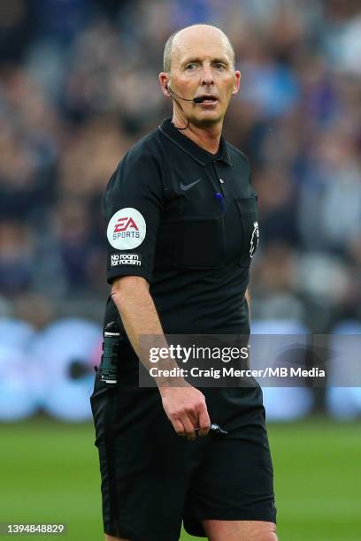Referee Mike Dean during the Premier League match between West Ham United and Arsenal at London Stadium on May 1, 2022 in London, United Kingdom.
