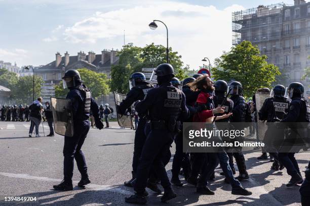 Riot police officers arrest a protester during a May Day rally on May 01, 2022 in Paris, France. Protests on International Workers' Day are an annual...