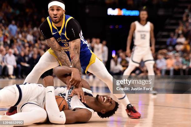Gary Payton II of the Golden State Warriors and Jaren Jackson Jr. #13 of the Memphis Grizzlies fight for the ball during Game One of the Western...