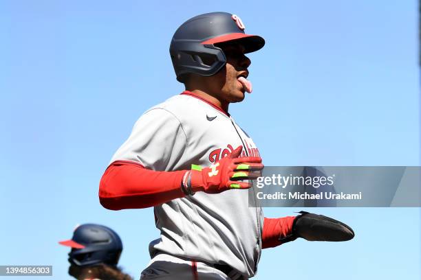 Juan Soto of the Washington Nationals sticks out tongue after scoring off a single in the top of the sixth inning against the San Francisco Giants at...