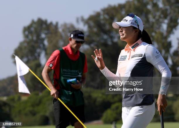 Jin Young Ko of South Korea reacts to her par putt on the 18th green to finish nine under par during the final round of the Palos Verdes Championship...