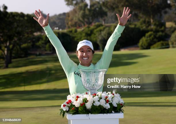 Marina Alex poses raises her arms in front of the trophy in celebration of victory during the final round of the Palos Verdes Championship Presented...