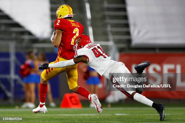 Jordan Suell of Philadelphia Stars runs with the ball as De'Vante Bausby of New Jersey Generals defends in the second quarter of the game at...