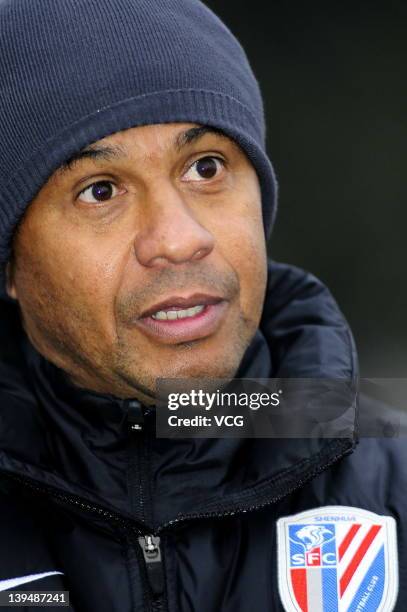 French coach Jean Tigana of Shanghai Shenhua talks to the media after a warm-up match between Shanghai Shenhua and Hunan Xiangtao at Shenhua Kangqiao...