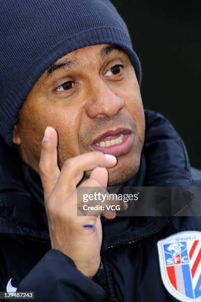 French coach Jean Tigana of Shanghai Shenhua talks to the media after a warm-up match between Shanghai Shenhua and Hunan Xiangtao at Shenhua Kangqiao...