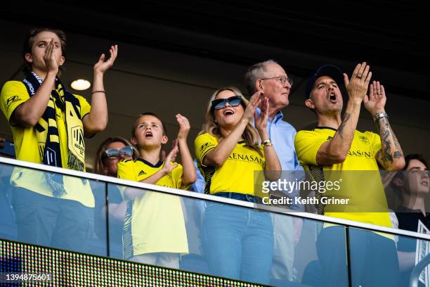 Reese Witherspoon with her sons Deacon Phillippe, Tennessee Toth and her husband Jim Toth, cheers on the Nashville Soccer Club during the Inaugural...