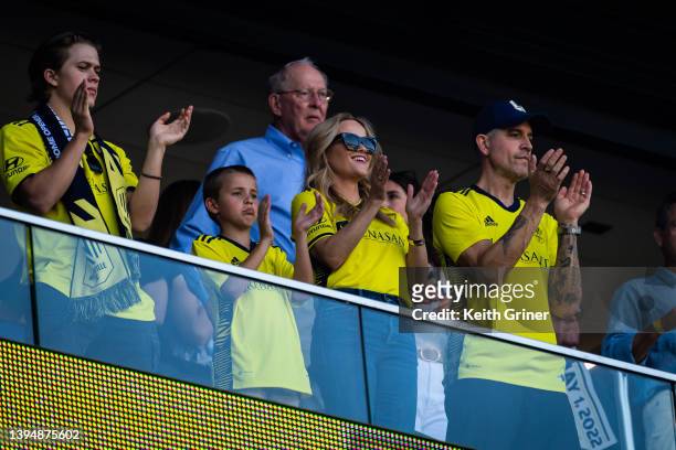 Reese Witherspoon with her sons Deacon Phillippe, Tennessee Toth and her husband Jim Toth, cheers on the Nashville Soccer Club during the Inaugural...