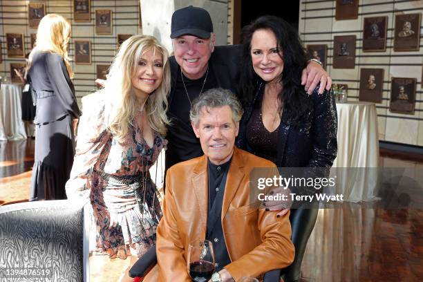 Lane Brody, inductee Eddie Bayers, Randy Travis and Mary Travis attend the class of 2021 medallion ceremony at Country Music Hall of Fame and Museum...