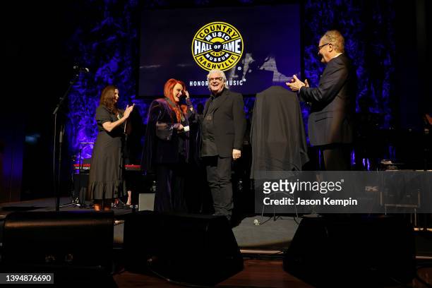 Ashley Judd accepts induction on behalf of Naomi Judd with inductee Wynonna Judd, Ricky Skaggs and CEO of the Country Music Hall of Fame and Museum...