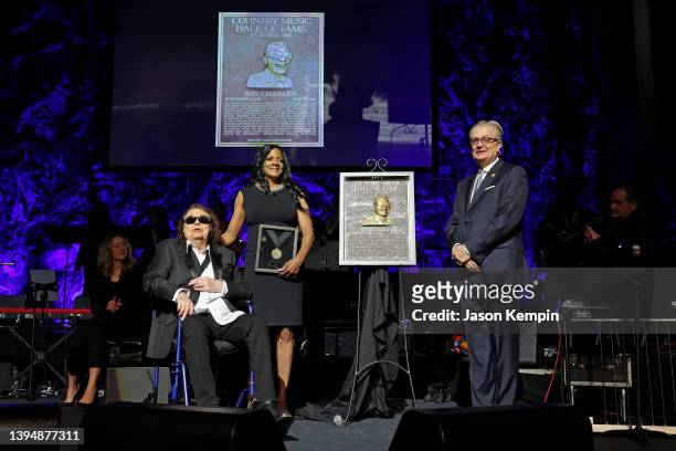 Ronnie Milsap, Valerie Ervin and CEO of the Country Music Hall of Fame and Museum Kyle Young speak onstage for the class of 2021 medallion ceremony...