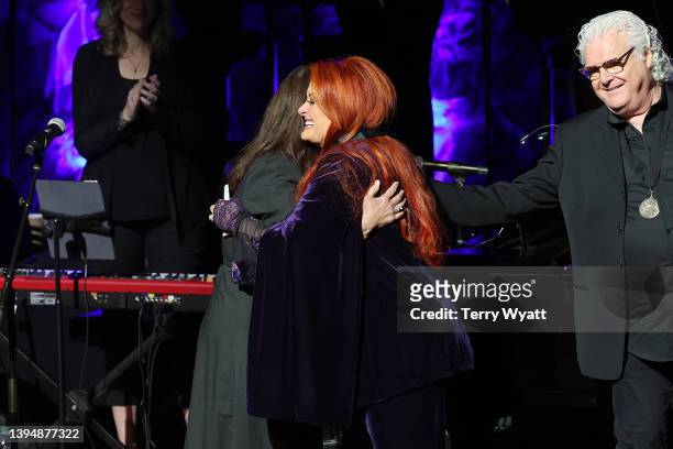 Ashley Judd accepts induction on behalf of Naomi Judd with inductee Wynonna Judd and Ricky Skaggs onstage for the class of 2021 medallion ceremony at...