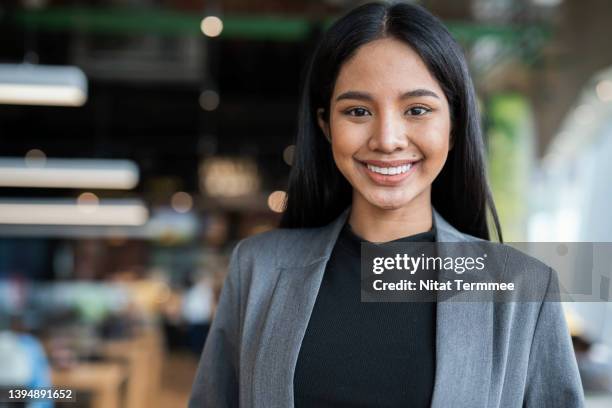 build your people to grow your company. portrait of young female businesswomen in a fin tech business. she is expert in financial management by using technology. - administrative professional stock-fotos und bilder