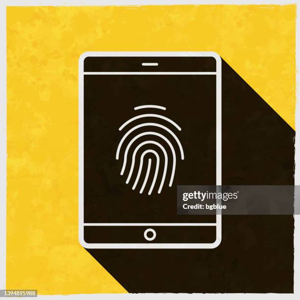 tablet pc with fingerprint. icon with long shadow on textured yellow background - scan texture stock illustrations