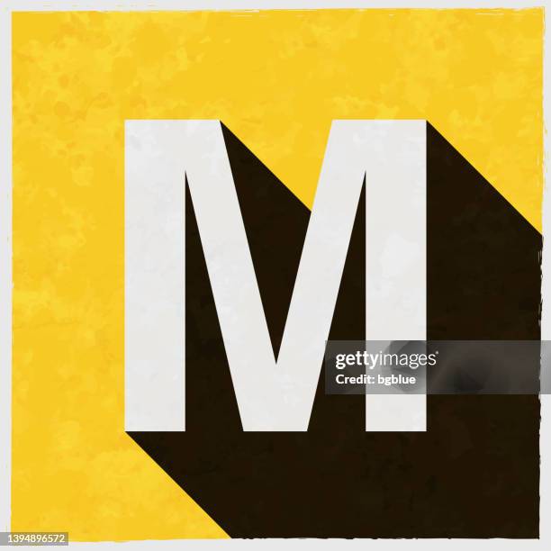 letter m. icon with long shadow on textured yellow background - letter m stock illustrations