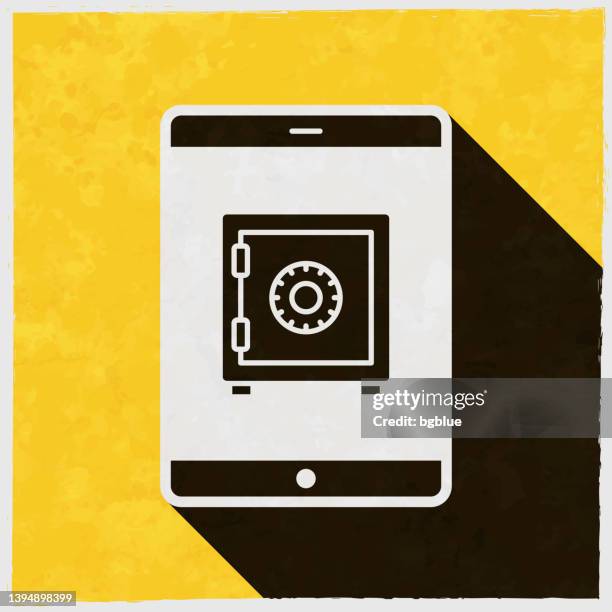 tablet pc mit safe. symbol mit langem schatten auf strukturiertem gelbem hintergrund - safety deposit box stock-grafiken, -clipart, -cartoons und -symbole