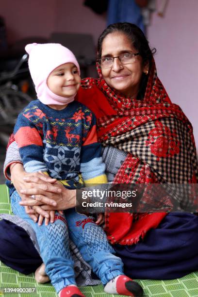 happy grandmother with her granddaughter - punjab stock pictures, royalty-free photos & images