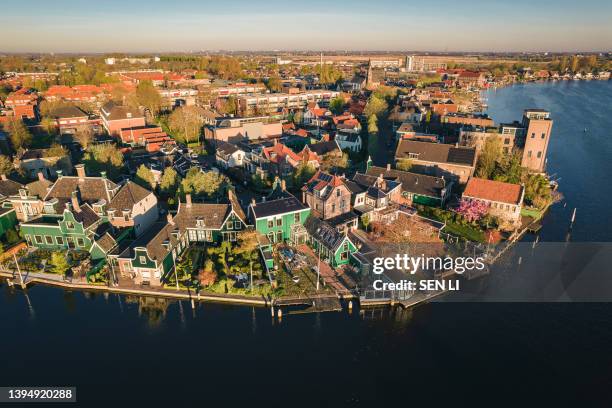 aerial view of the historical village with old windmills at sunrise in zaanse schans, netherlands - zaandam stock pictures, royalty-free photos & images