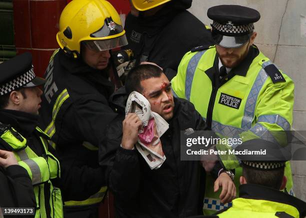 Medical workers evacuate a simulated casualty during an emergency services exercise at the disused Aldwych underground station on February 22, 2012...