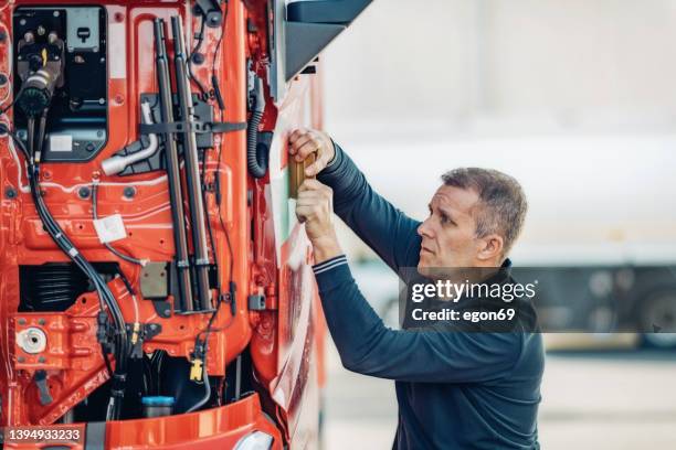stick the company logo on the truck - truck repair stock pictures, royalty-free photos & images