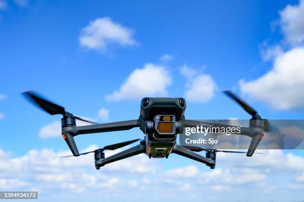 dji mavic 3 drone flying in the air - dji drone stock pictures, royalty-free photos & images
