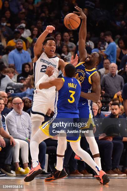 Desmond Bane of the Memphis Grizzlies looks to pass against Draymond Green of the Golden State Warriors during Game One of the Western Conference...