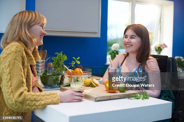 friends chatting at home in zero waste kitchen with plant based smoothie. - drinking straw stock pictures, royalty-free photos & images