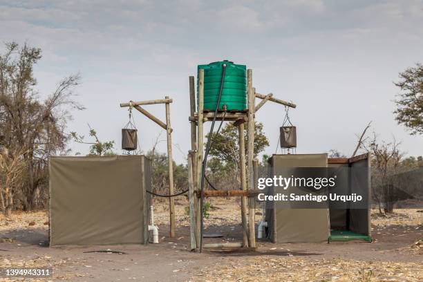 showers in dijara camp - water tower storage tank stock pictures, royalty-free photos & images