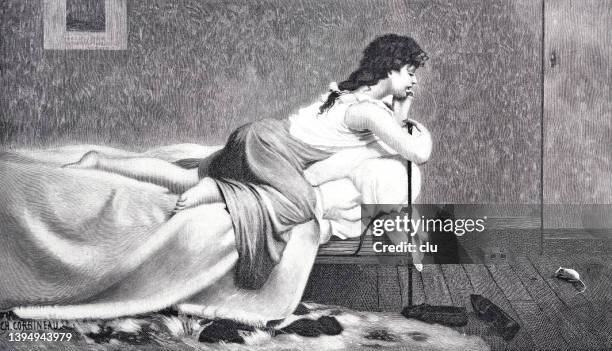 young woman lying on bed looking for a mouse on the floor - woman black and white stock illustrations