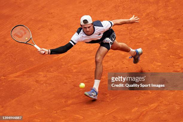 Tommy Paul of USA returns a ball to Jannik Sinner of Italy during their Men's Singles match on Day Five of the Mutua Madrid Open at La Caja Magica on...