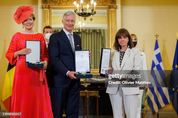 King Philippe of Belgium, Queen Mathilde, and President of Greece Katerina Sakellaropoulou exchange decorations at the Presidential Mansion on the...