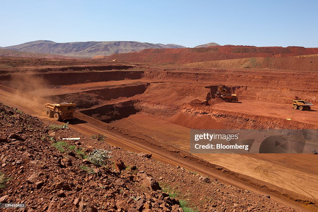 Pit Tech Rio Tinto An autonomous haul truck drives into a pit at Rio Tinto Group's West ...