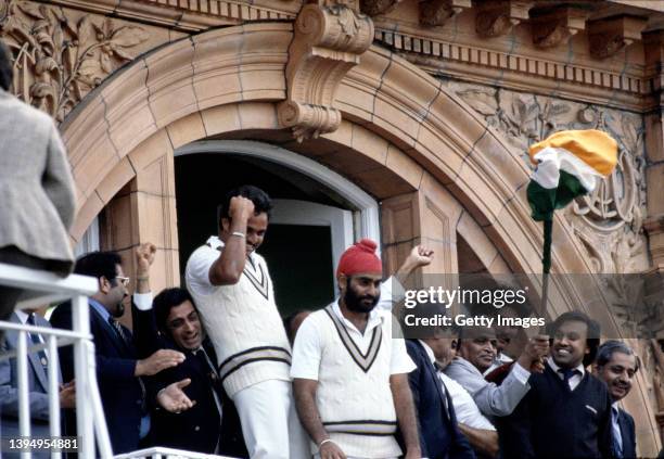 India players and officials celebrate on the players balcony after the 1983 Cricket World Cup final Match between India and West Indies at Lords on...