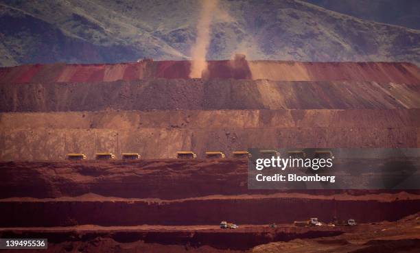 Heavy machinery operates in a pit at Rio Tinto Group's West Angelas iron ore mine in Pilbara, Australia, on Sunday, Feb. 19, 2012. Rio Tinto Group,...