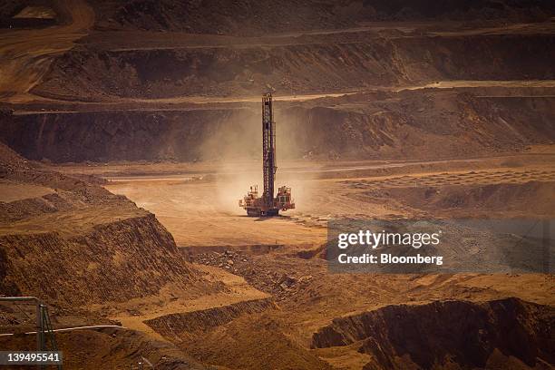 Blast hole drill operates in the pit at Rio Tinto Group's West Angelas iron ore mine in Pilbara, Australia, on Sunday, Feb. 19, 2012. Rio Tinto...